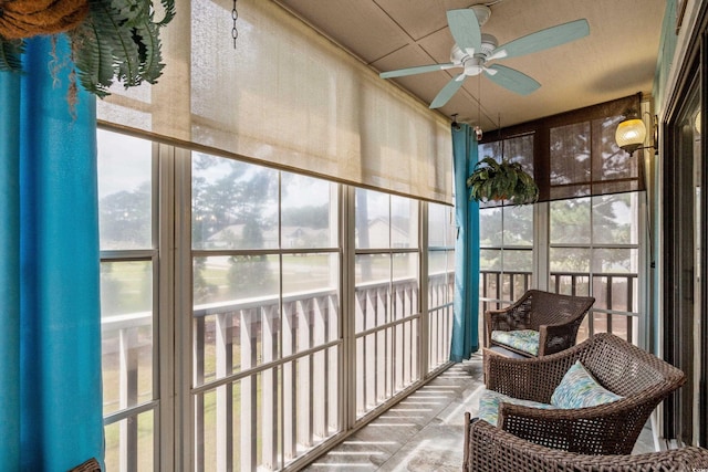 sunroom with ceiling fan and a healthy amount of sunlight