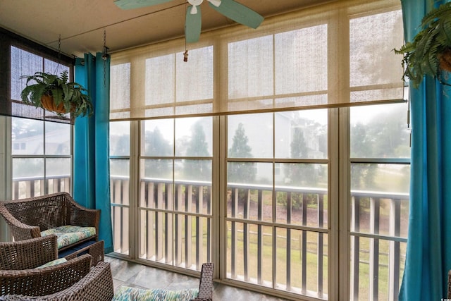 sunroom / solarium with ceiling fan and plenty of natural light