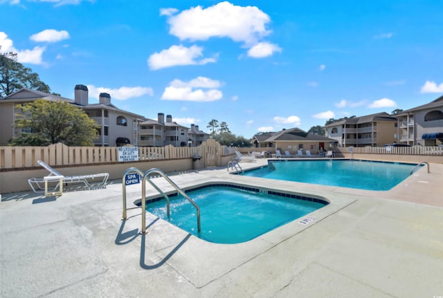 view of swimming pool featuring a patio