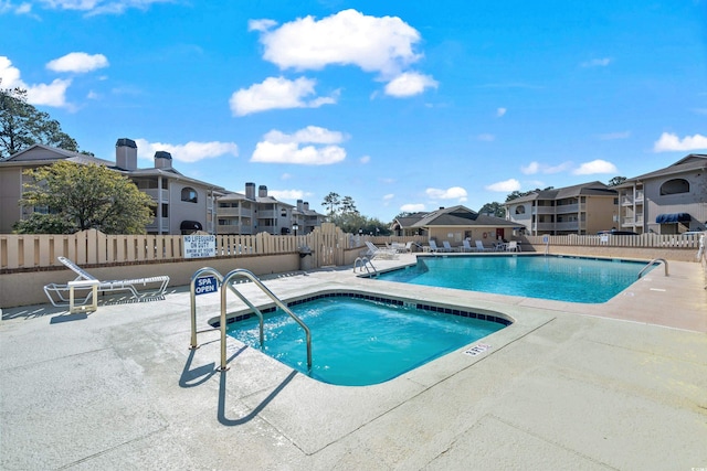 view of swimming pool with a patio area