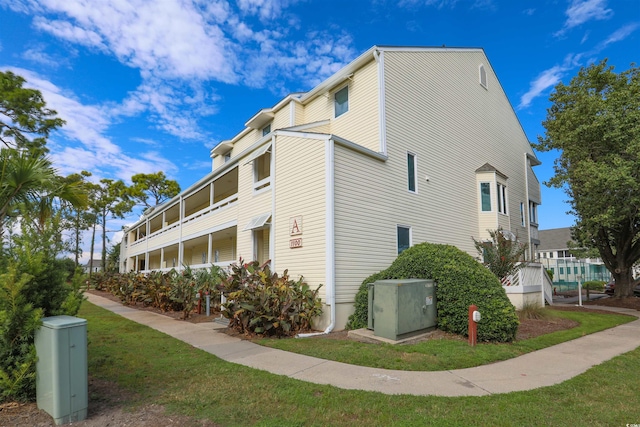 view of home's exterior with a yard