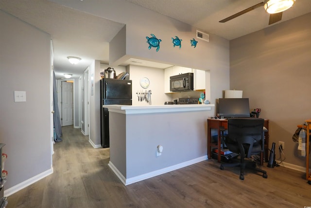 office area with ceiling fan and hardwood / wood-style floors