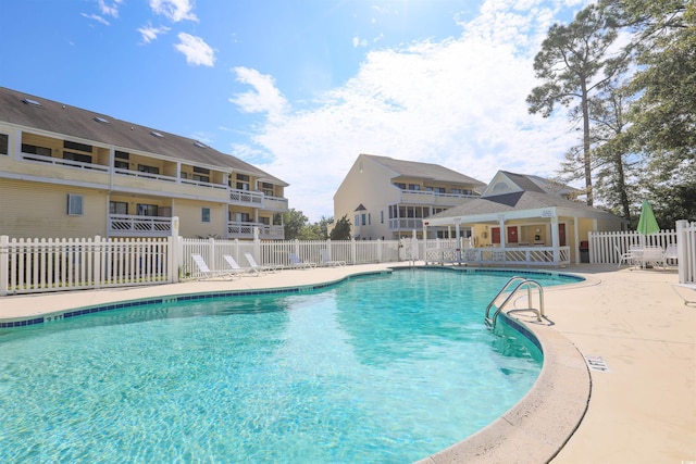 view of swimming pool with a patio area