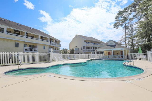 view of swimming pool featuring a patio