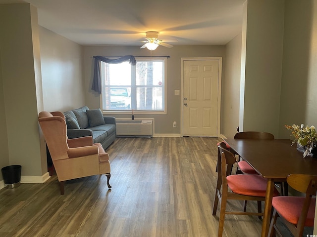 living area featuring wood-type flooring and ceiling fan