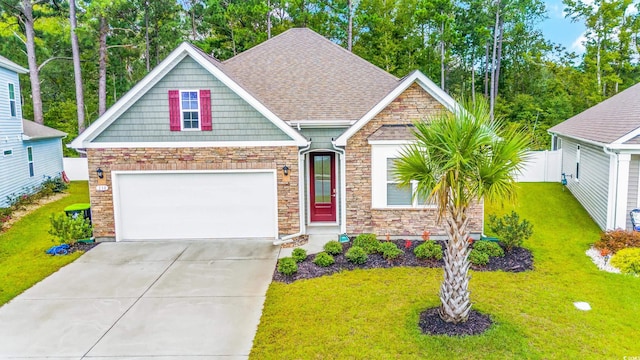 craftsman house featuring a garage and a front lawn