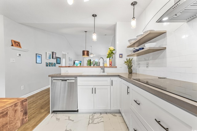 kitchen featuring dishwasher, sink, white cabinets, vaulted ceiling, and hanging light fixtures