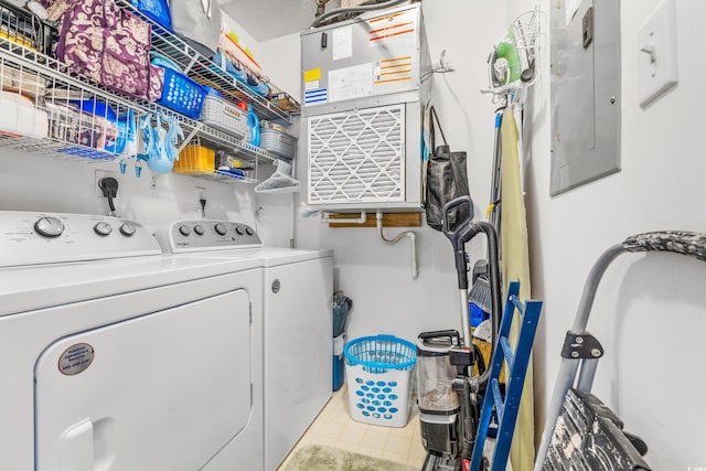 washroom featuring washer and clothes dryer and electric panel