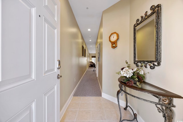 corridor featuring light tile patterned floors