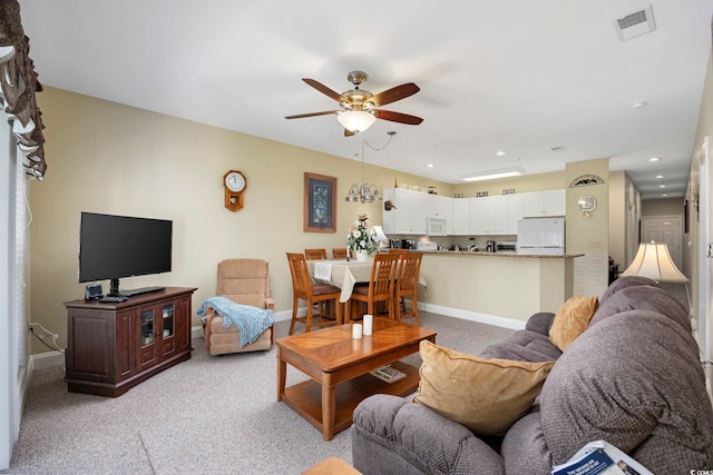 living room with light carpet and ceiling fan