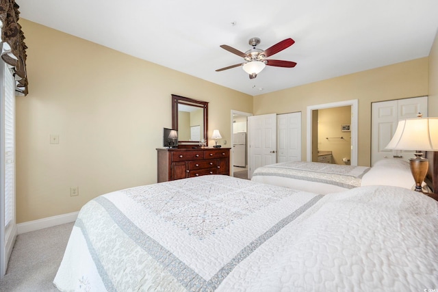 carpeted bedroom featuring connected bathroom and ceiling fan