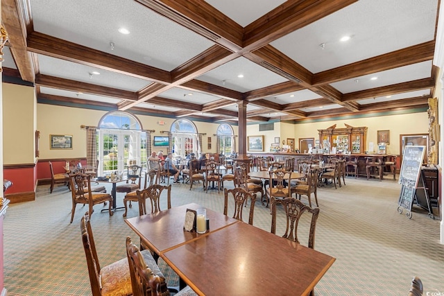 dining area with light carpet, beamed ceiling, a textured ceiling, and coffered ceiling