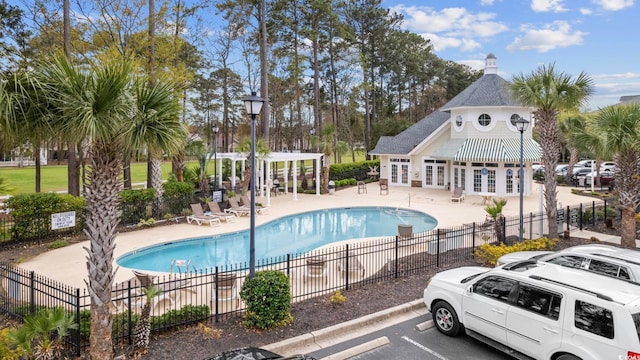 view of swimming pool with a patio