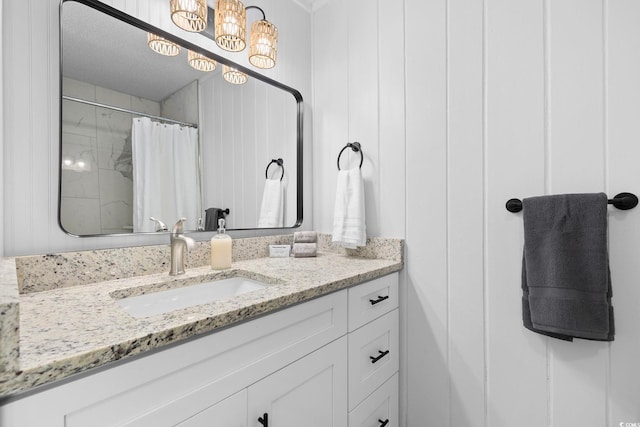 bathroom with vanity and curtained shower