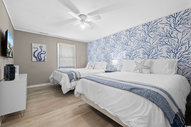 bedroom featuring ceiling fan and light hardwood / wood-style flooring