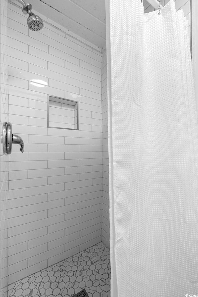 bathroom featuring walk in shower