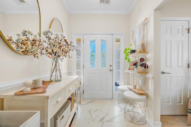 carpeted foyer with ornamental molding