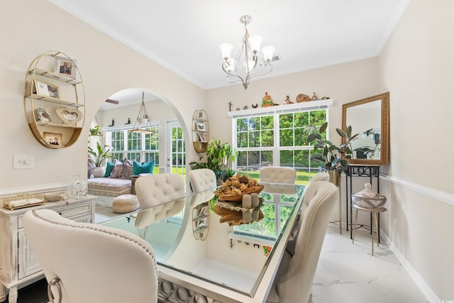 dining room featuring an inviting chandelier and ornamental molding