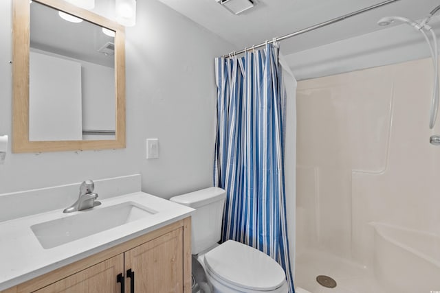 bathroom with vanity, toilet, and a shower with curtain