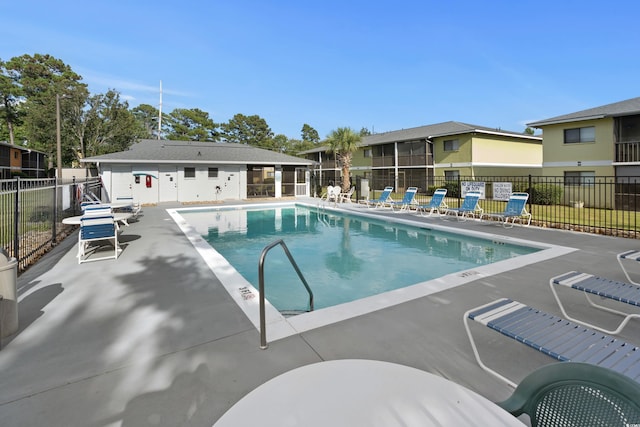 view of swimming pool with a patio