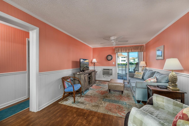 living room with ceiling fan, hardwood / wood-style flooring, and crown molding