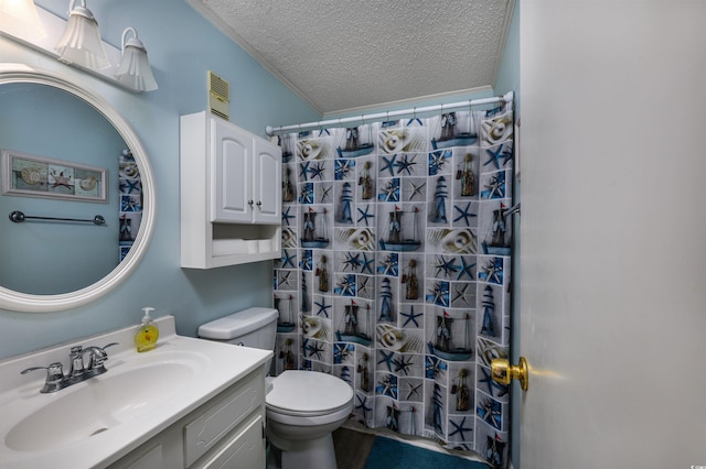 bathroom featuring a textured ceiling, vanity, toilet, and a shower with curtain