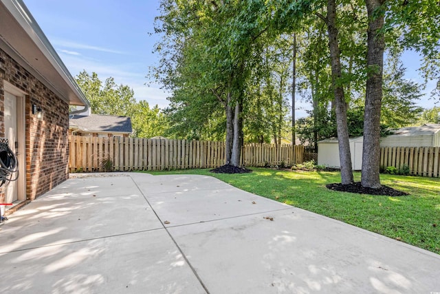 view of patio featuring a shed