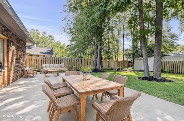 view of patio / terrace featuring an outdoor hangout area and a shed