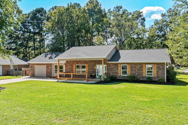 single story home featuring a garage and a front lawn