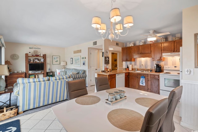 5905 S Kings Hwy Unit 219-B, Myrtle Beach, SC 29575 - dining space featuring light tile patterned floors, a ceiling fan, and a chandelier