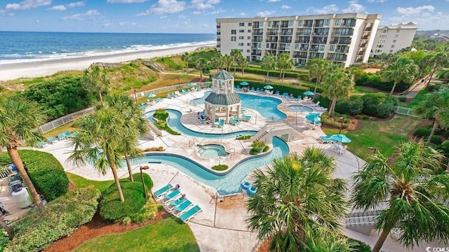 drone / aerial view with a view of the beach and a water view