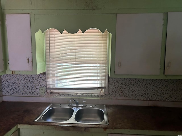 kitchen with decorative backsplash and sink