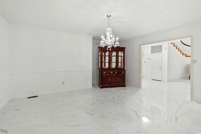 unfurnished dining area with a chandelier