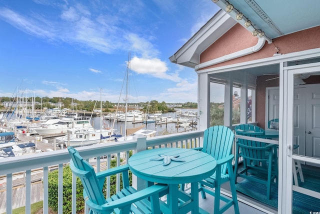 balcony featuring a water view