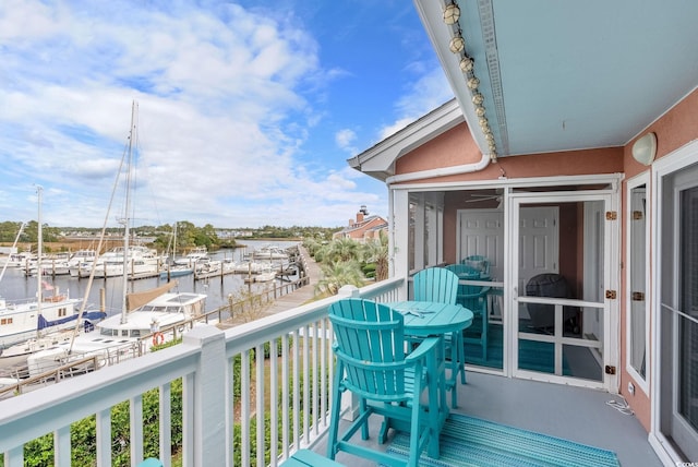 balcony featuring a water view