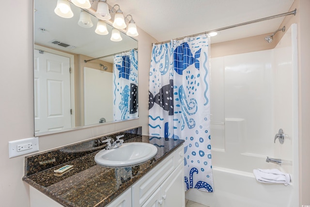 bathroom featuring vanity and shower / tub combo