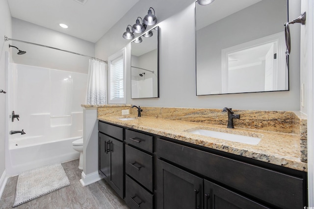 full bathroom with shower / tub combo, vanity, toilet, and hardwood / wood-style floors