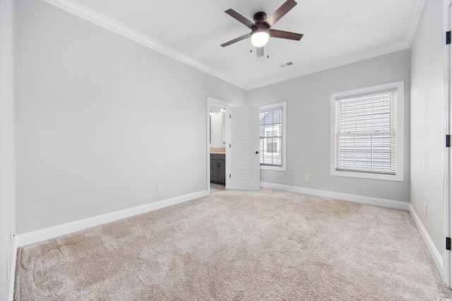 unfurnished bedroom with ceiling fan, connected bathroom, crown molding, and light carpet