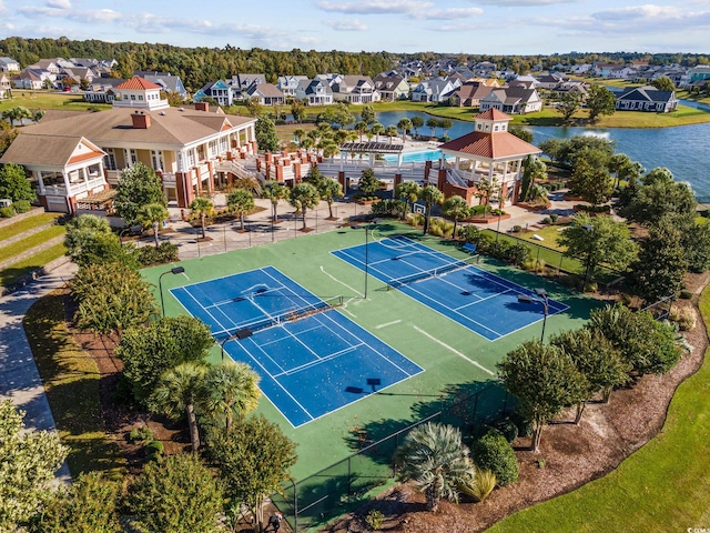 view of sport court featuring a water view