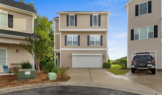view of front of home with a garage and concrete driveway