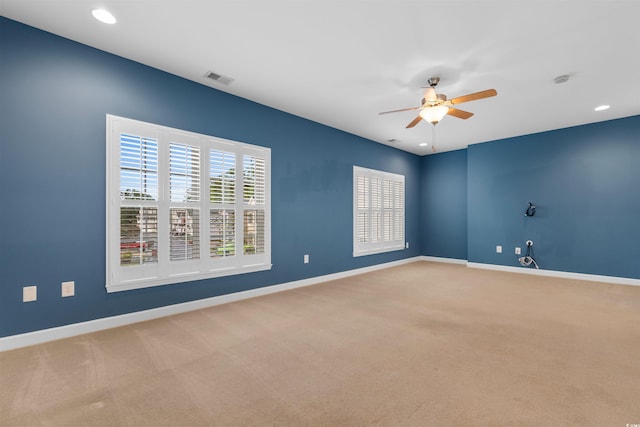empty room featuring carpet, a ceiling fan, baseboards, visible vents, and recessed lighting
