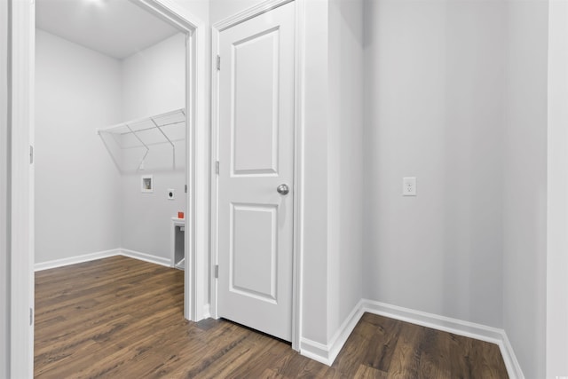 laundry area featuring dark wood-type flooring, attic access, hookup for an electric dryer, laundry area, and baseboards