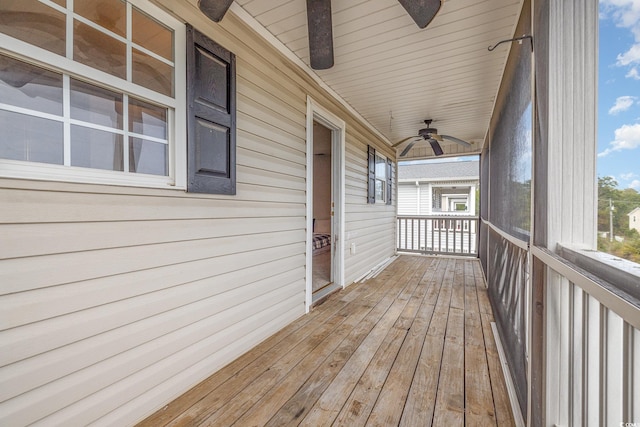 wooden terrace with ceiling fan