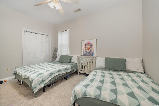 bedroom with carpet, a closet, and ceiling fan