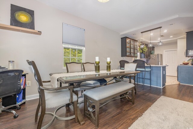 dining room with dark wood-type flooring