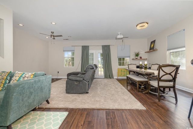 living room featuring dark hardwood / wood-style floors and ceiling fan