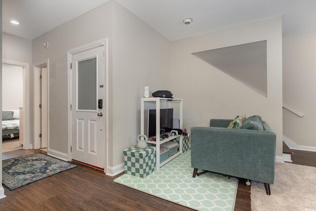 living area with dark hardwood / wood-style floors