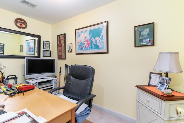 office area with light carpet and a textured ceiling