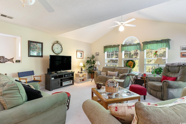 living room with vaulted ceiling, ceiling fan, and light colored carpet