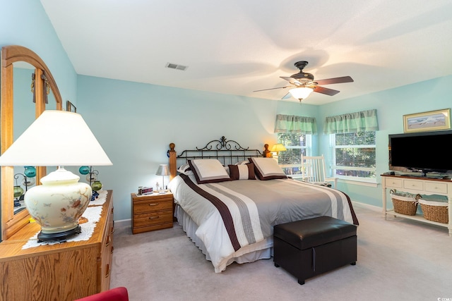 bedroom featuring ceiling fan and light colored carpet